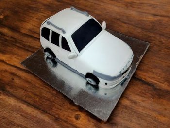 white-suv-stormer-theme-cake